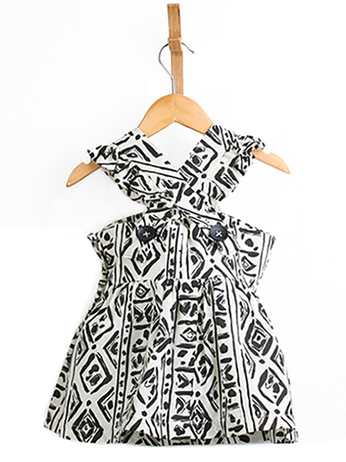Little girls black and white dress hanging on a white background shot in studio ECommerce Photography Fort Lauderdale